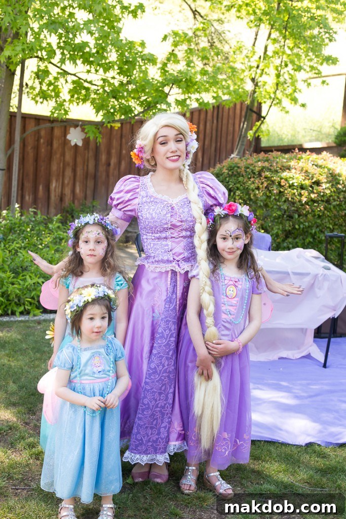 Smiling Birthday Girls with Princess Wands at Their Tea Party