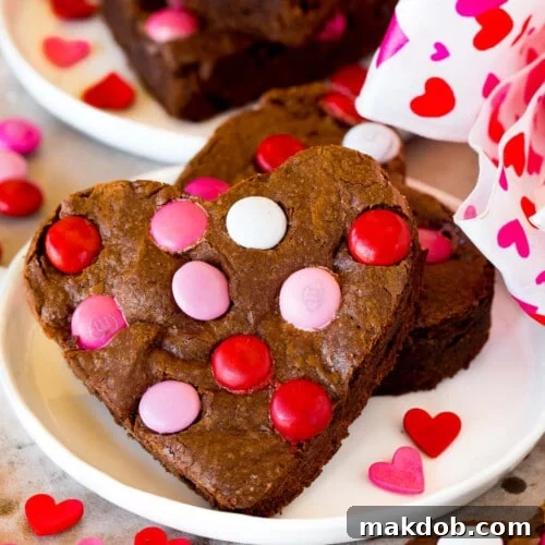 Sweetheart Brownies 7 Valentine brownies on a plate, decorated with M&M's.