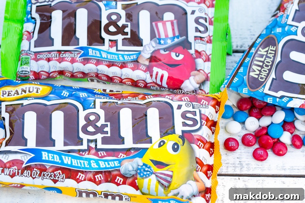 Bags of patriotic red, white, and blue M&M's in milk chocolate, peanut, and s'mores varieties.