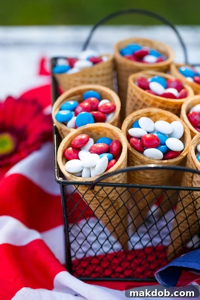 Red, White & Blue M&M's Candy Cones Ice cream cones charmingly filled with colorful Red, White & Blue M&M's, ideal for party favors.