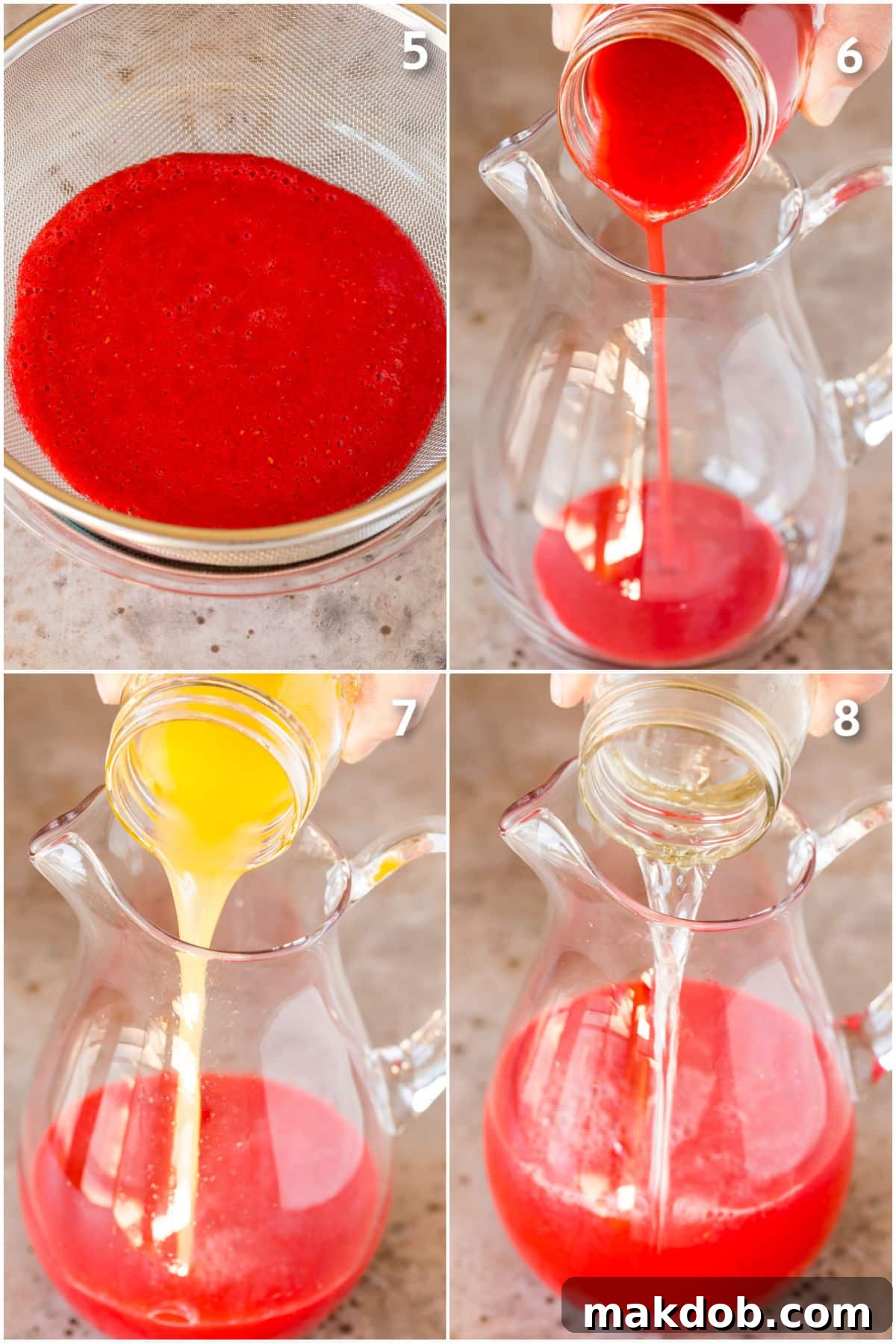 A hand pouring raspberry puree into a large glass pitcher, which already contains lemon juice and water, illustrating the final mixing step for the lemonade.