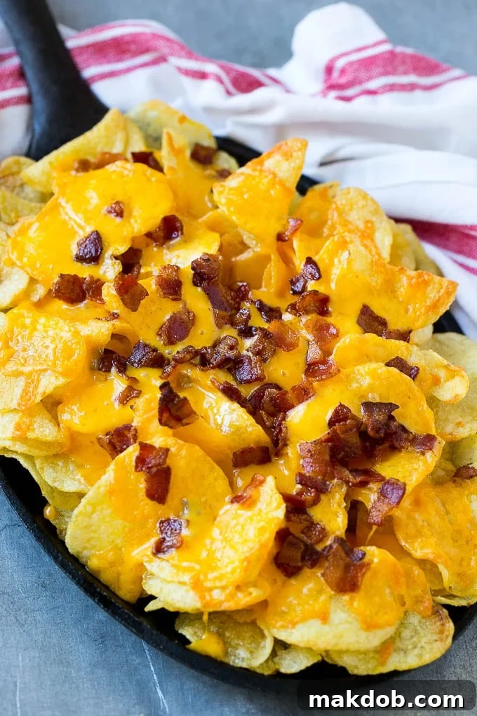 Irish Nachos Recipe | Potato Nachos | Potato Chip Recipe | Appetizer Recipe #nachos #potatoes #cheese #bacon #appetizer #dinneratthezoo Potato chips topped with melted cheese and bacon.