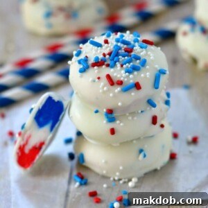 A stack of three patriotic Cherry Vanilla All American Patties in red, white, and blue hues.