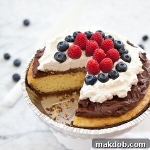A decadent Birthday Cake Pie with rich chocolate mousse and vibrant berries, ideal for a festive celebration.