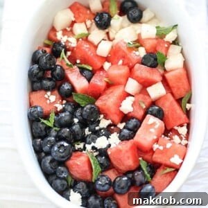 A picture of salad made with blueberries, watermelon and jicama.