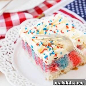 A delicious slice of Red, White, and Blue Marble Sheet Cake, a perfect patriotic dessert for the 4th of July.