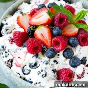 This berry cheesecake salad recipe is a variety of fresh berries tossed in a light and creamy cheesecake mixture. The perfect summer salad!