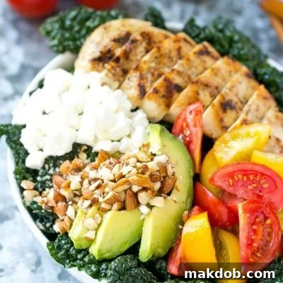 This recipe for Tuscan kale salad is full of kale, grilled chicken, avocado, tomatoes, almonds and feta cheese, all tossed in a simple lemon dressing. An easy and healthy meal! #LaneToGreatness #ad