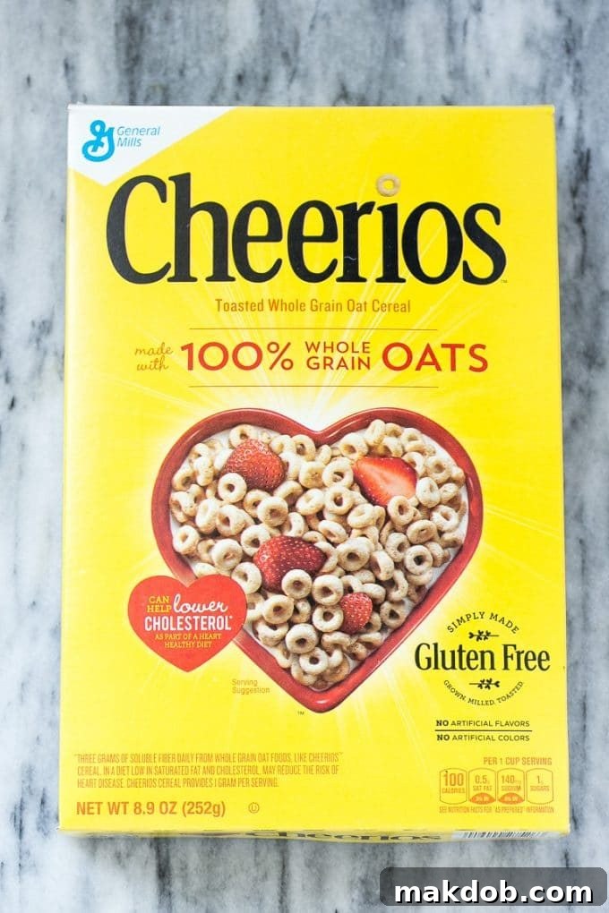 A classic yellow box of Cheerios cereal, an essential ingredient for a crunchy and healthy breakfast sundae.
