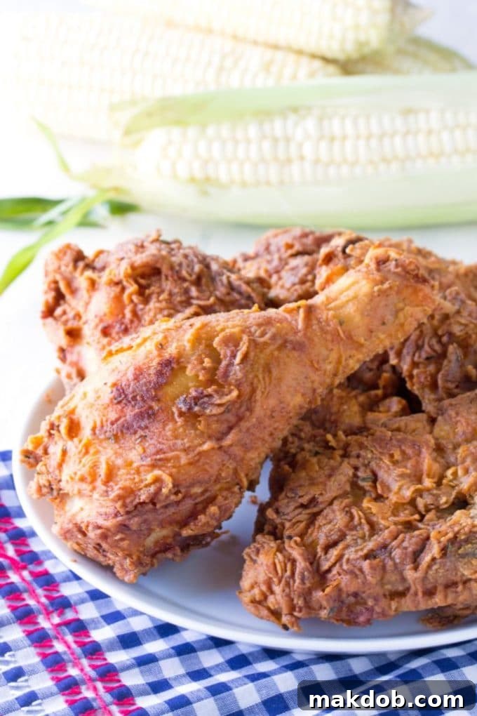 Golden brown and incredibly crispy Cajun Fried Chicken, seasoned with bold spices, perfect for a decadent weekend treat.