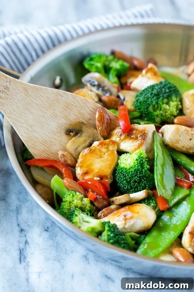 Chicken almond ding with chicken, broccoli, peppers, mushrooms and almonds, all in a savory sauce.
