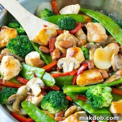 This recipe for chicken almond ding is a stir fry full of chicken, veggies and crunchy almonds, all tossed in a savory sauce. The perfect healthy dinner that's ready in a flash! #LaneToGreatness #ad