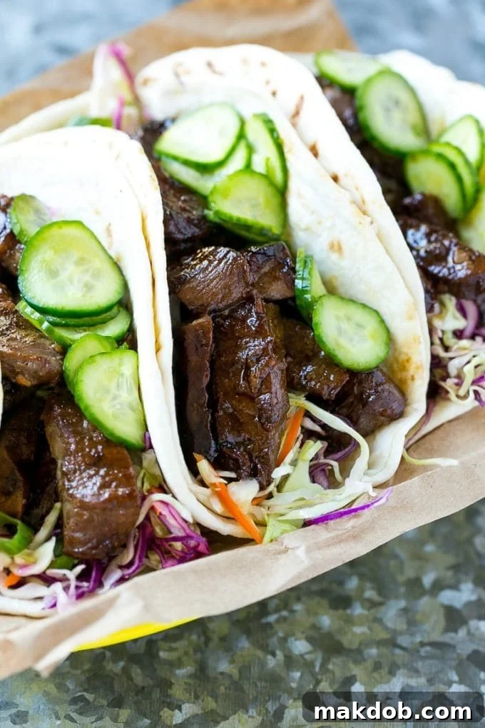 Korean BBQ tacos with cabbage and pickled cucumbers, showcasing the vibrant colors and fresh ingredients.