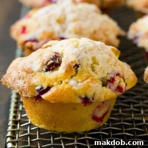 Baked cranberry muffins topped with streusel.