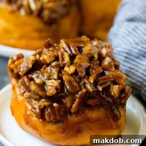 Sticky buns topped with caramel and pecans.
