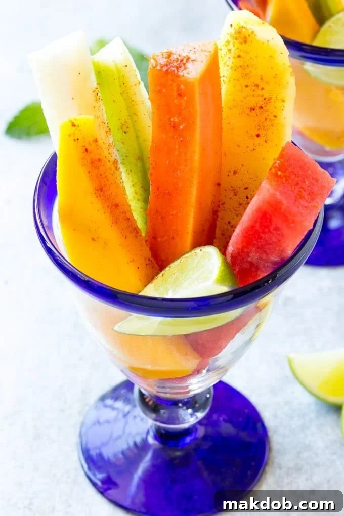 Mexican Fruit Cups | Fruit Cups | Mexican Fruit | Tropical Fruit #fruit #fruitcup #watermelon #pineapple #snack #healthy #dinneratthezoo Fruit cups filled with watermelon, cucumber, papaya and mango.