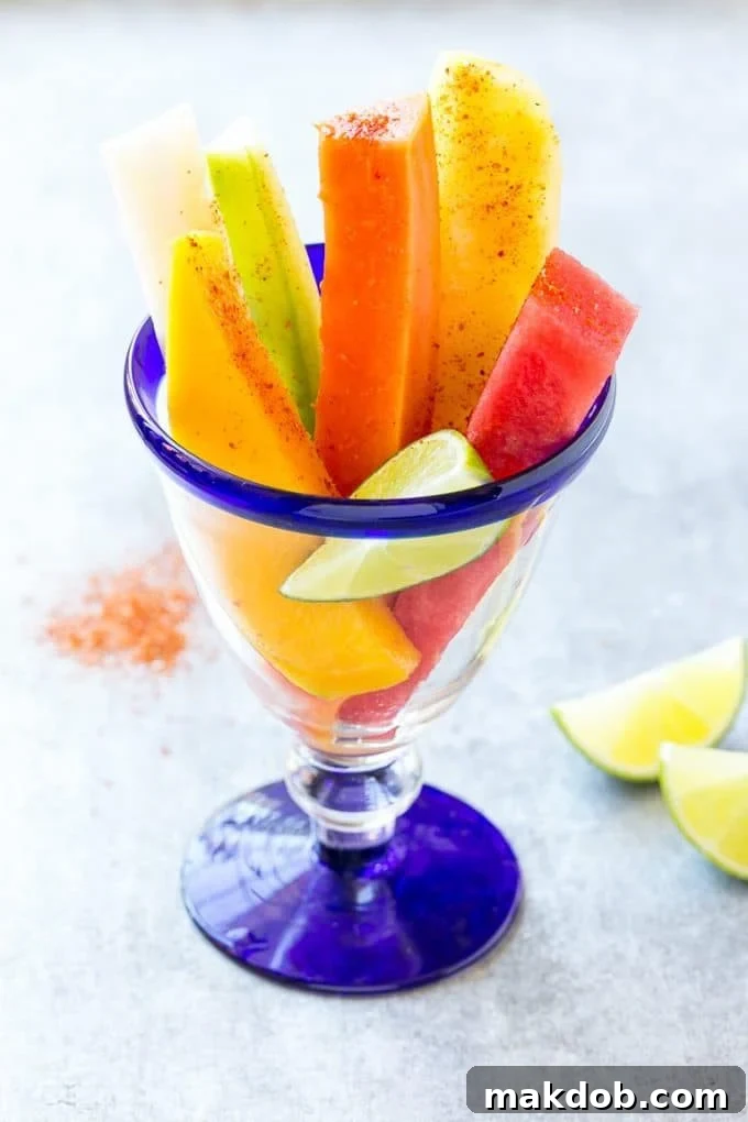 Mexican Fruit Cups | Fruit Cups | Mexican Fruit | Tropical Fruit #fruit #fruitcup #watermelon #pineapple #snack #healthy #dinneratthezoo Mexican fruit cups topped with chili lime seasoning.