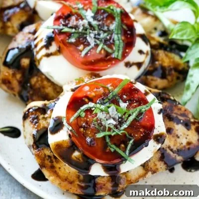 This recipe for chicken caprese is grilled seasoned chicken, topped with fresh mozzarella, ripe tomatoes, basil and balsamic reduction. A quick and easy dinner that's easy enough for a busy weeknight but special enough to serve to company!