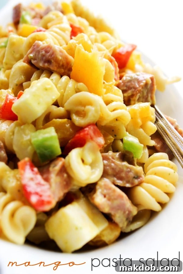 Refreshing Mango Pasta Salad with vibrant fruit and fresh herbs