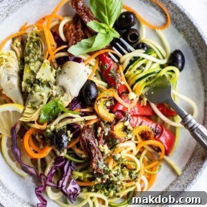 A refreshing plate of Italian zucchini noodle salad, perfect for summer.