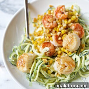 A bowl of delectable Chili Lime Shrimp and Scallops served with fresh Zucchini Noodles.