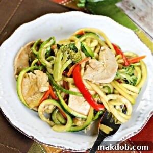A bowl of low carb chicken zoodle lo mein, a healthier take on takeout.