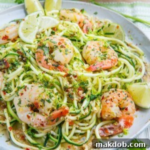 A plate of savory cilantro lime shrimp scampi served with zucchini noodles.