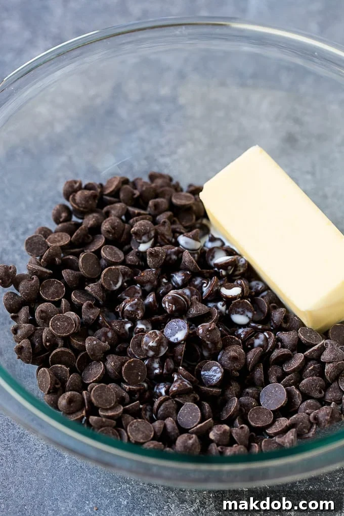 Mint Brownies Recipe | Layered Brownies | Frosted Brownies #brownies #chocolate #frosting #mint #dessert #dinneratthezoo Chocolate chips, butter and cream in a mixing bowl.