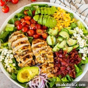Grilled chicken salad with crispy bacon, fresh veggies, and tangy blue cheese crumbles.