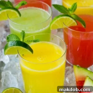 An array of colorful agua fresca drinks, each in assorted fruit flavors, served in individual cups.
