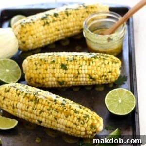 Several ears of toaster oven baked corn on the cob, golden and tender, showcasing a convenient and efficient way to cook corn in a smaller appliance. The image implies ease of preparation and perfect results without needing to heat a full-sized oven, ideal for quick meals or smaller households.