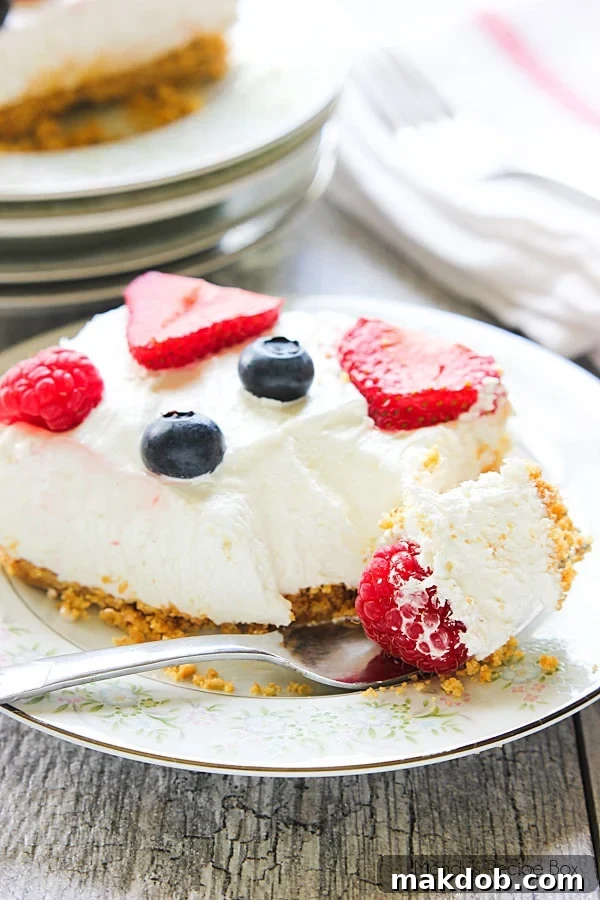 No Bake Berry Cheesecake, a refreshing and easy dessert with a creamy filling and fresh berries.