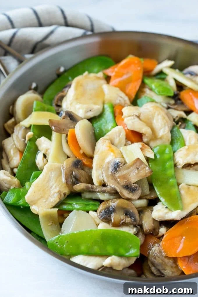 Chicken, mushrooms, snow peas and carrots in a savory sauce. Essential ingredients for a delicious chicken and mushroom stir fry.