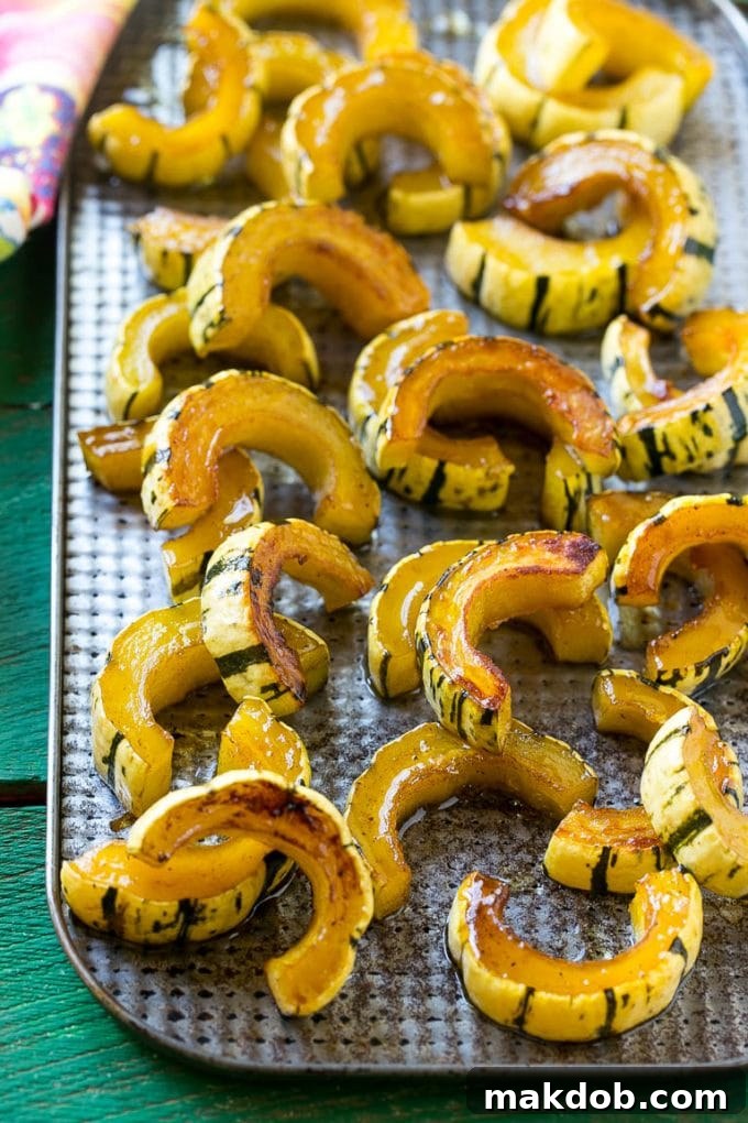 A sheet pan of a cooked winter squash recipe.