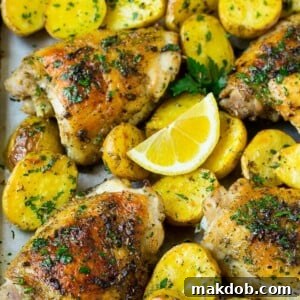 A tempting sheet pan of Greek chicken and potatoes, infused with fragrant garlic, herbs, and bright lemon.
