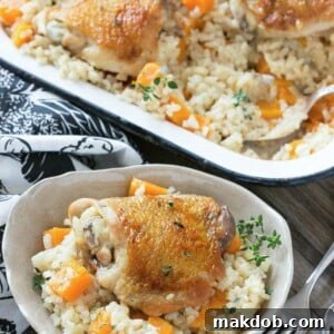 This One Pot Oven Chicken and Rice Bake combines succulent chicken with creamy parmesan rice and sweet butternut squash for a wholesome meal.