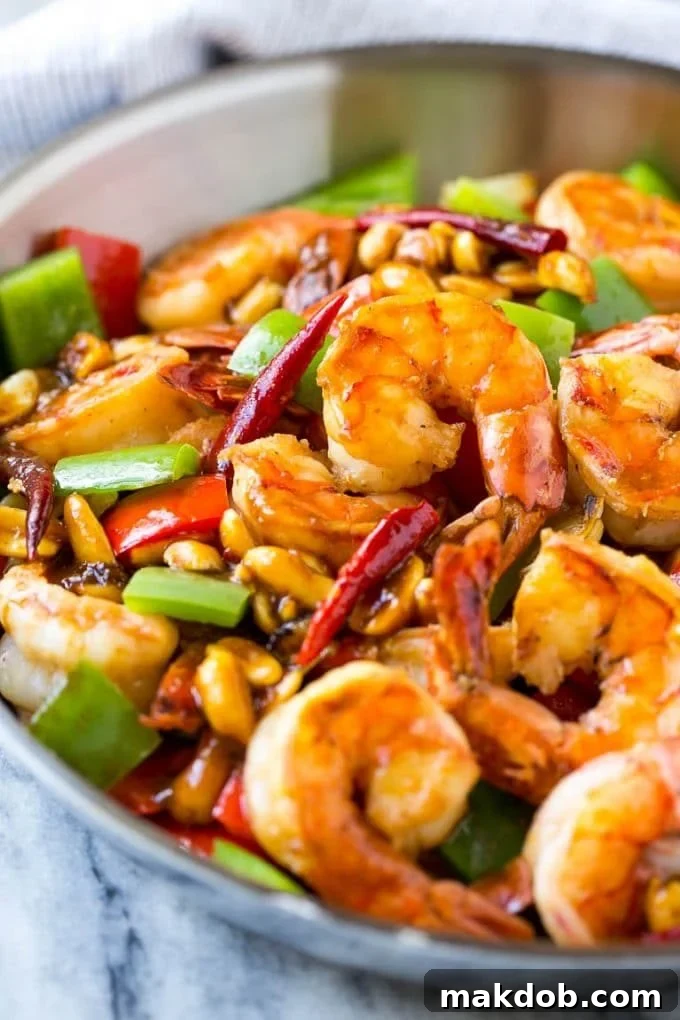 Kung Pao Shrimp | Shrimp Recipe | Shrimp Stir Fry | Easy Shrimp Recipe #shrimp #stirfry #peppers #dinner #dinneratthezoo #spicy Shrimp in a savory and spicy sauce in a metal pan.
