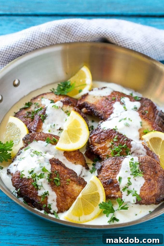 Perfectly Seared Pork Scallopini with Golden Brown Crust Golden brown pork loin sliced and topped with sauce, showcasing a perfect sear.