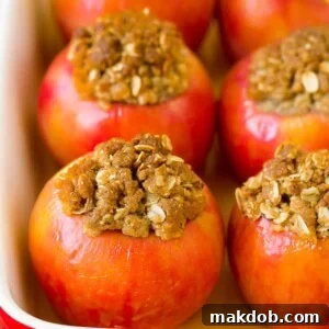 Sweet baked apples, generously filled with a delightful mixture of wholesome oatmeal, rich brown sugar, and crunchy walnuts, baked until golden and tender.