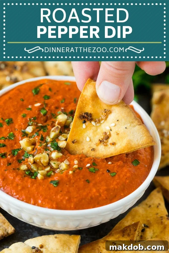 Close-up of a rich, creamy roasted red pepper dip, Muhammara, showcasing its vibrant color and smooth texture. Ideal for appetizer spreads.