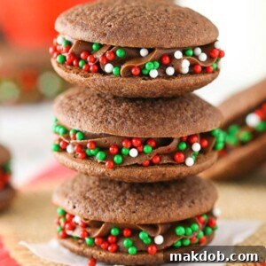 An image of three stacked double chocolate sandwich cookies, revealing their creamy filling.