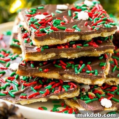 Irresistible Holiday Toffee Bark 7 A platter of Christmas crack, garnished with holiday sprinkles.