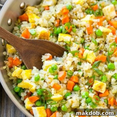 This cauliflower fried rice has all the flavors of your favorite take out dish, but without the carbs; the perfect healthier side dish!