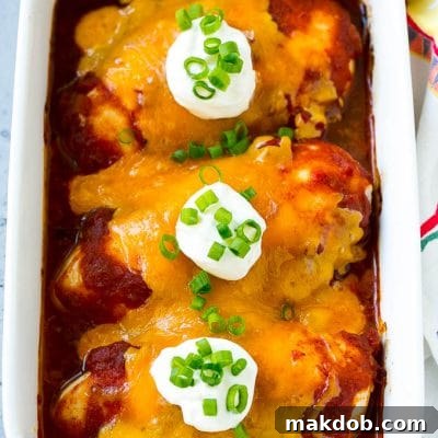 Zesty Salsa Chicken 2 A dish of baked salsa chicken topped with cheese and sour cream.