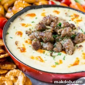 This Wisconsin Brat & Beer Cheese Dip is creamy, cheesy and loaded with bratwurst. It's a hearty appetizer that's perfect for game day entertaining!