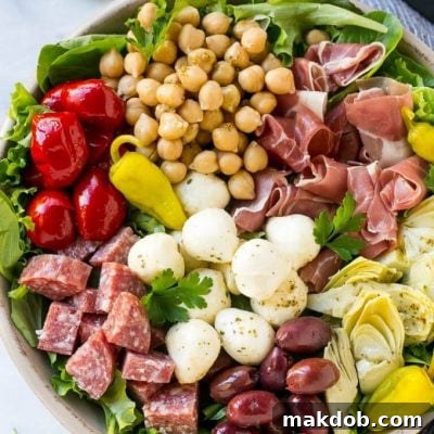 Gourmet Antipasto Salad 2 This recipe for antipasto salad is loaded with Italian meats, cheese and veggies, all tossed in a homemade zesty dressing.