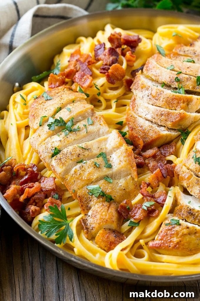 This recipe for butternut squash pasta is linguine in a creamy butternut squash sauce, topped with chicken, bacon and herbs. An easy and delicious dinner that's perfect for fall! #FamilyPastaTime #ad