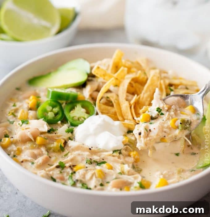 A hearty and creamy Slow Cooker Creamy White Chicken Chili, perfect for a cozy mid-week dinner.