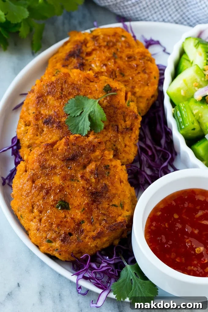 Thai fish cakes served over shredded cabbage with cucumber salad.