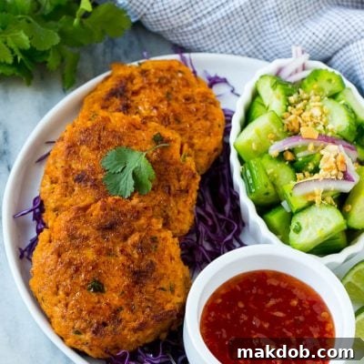 This recipe for Thai fish cakes is sweet and spicy salmon formed into patties and cooked to a golden brown. Serve the fish cakes with a cool cucumber salad and sweet chili dipping sauce for a delicious appetizer or main course!